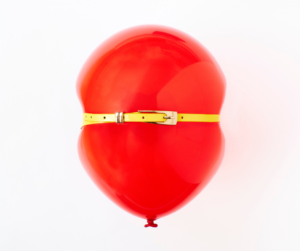 Bloating red balloon that is full