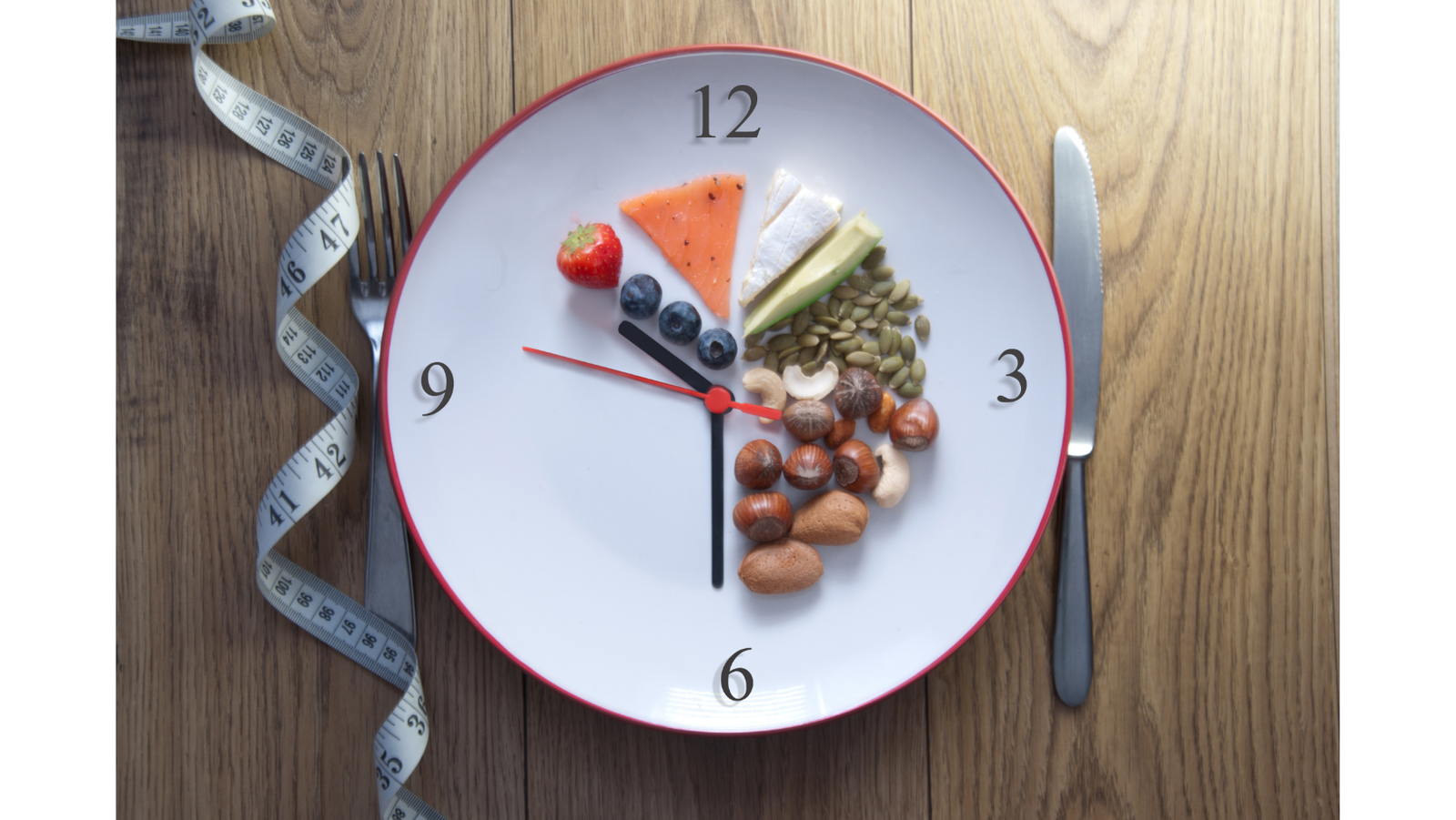 intermittent fasting in menopause plate with clock and food 